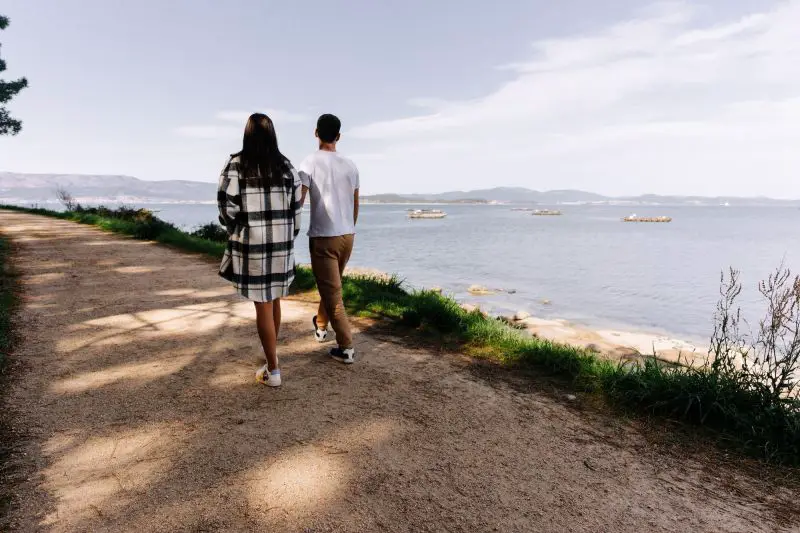 Young couple taking a walk near the ocean