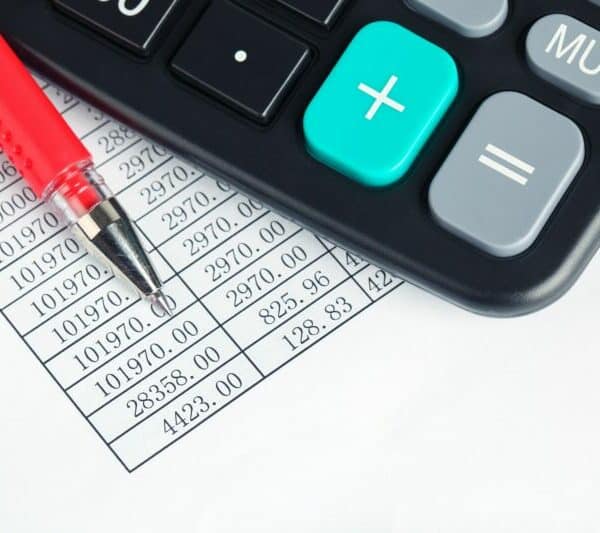calculator and red pen
