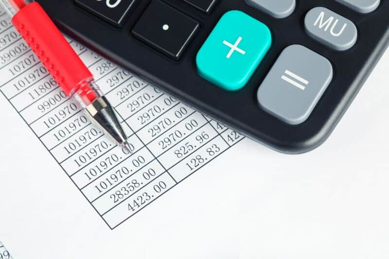 calculator and red pen
